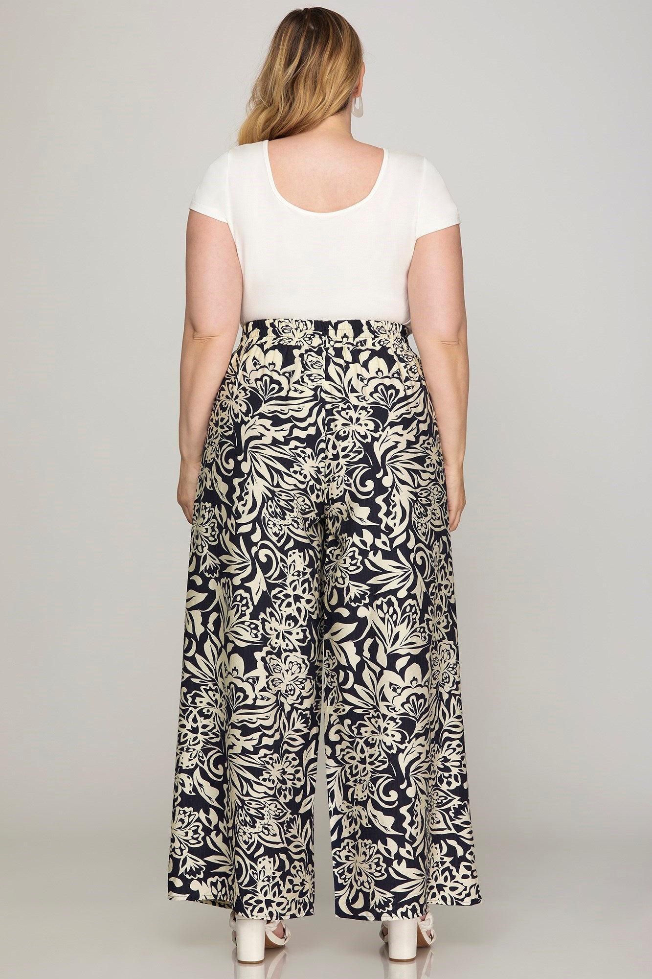 Pantalon palazzo marine à motifs