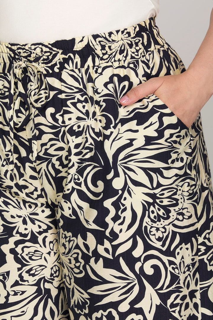 Pantalon palazzo marine à motifs